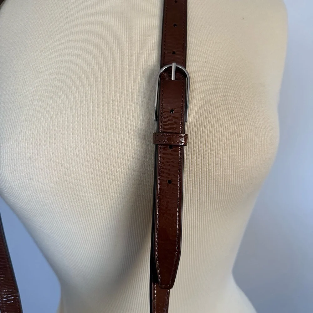 Tory Burch half moon patent leather brown purse with crossbody strap